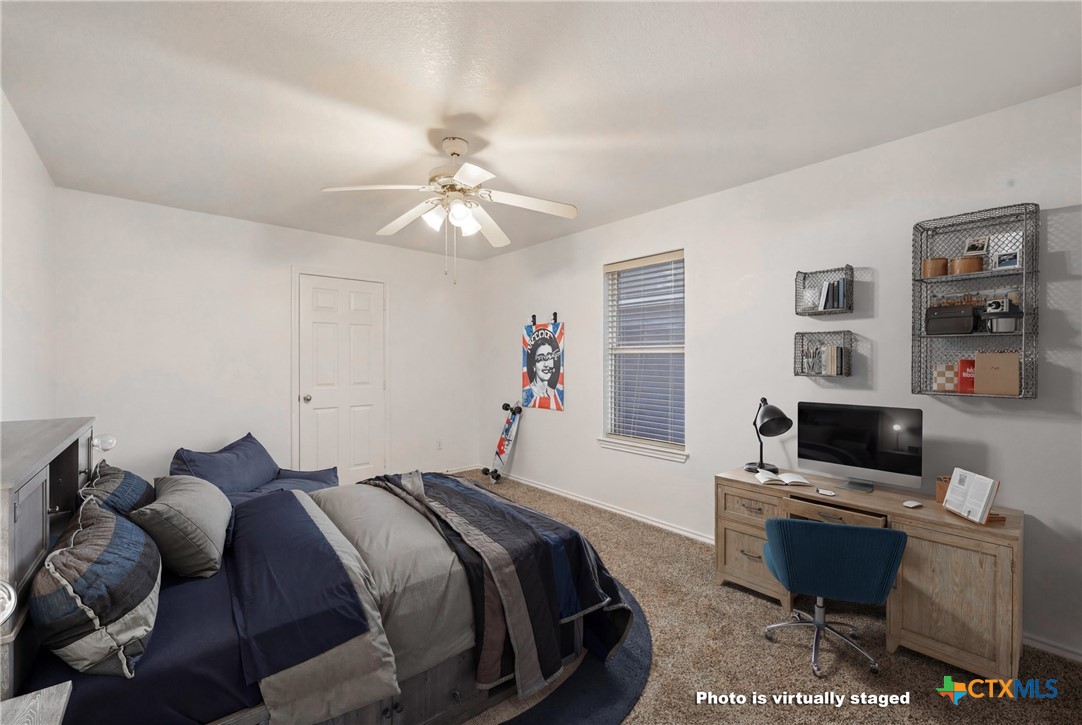 6525 Brooks Drive Temple, TX 76502 - Photo 26 of 37 a bed room with a bed and a television