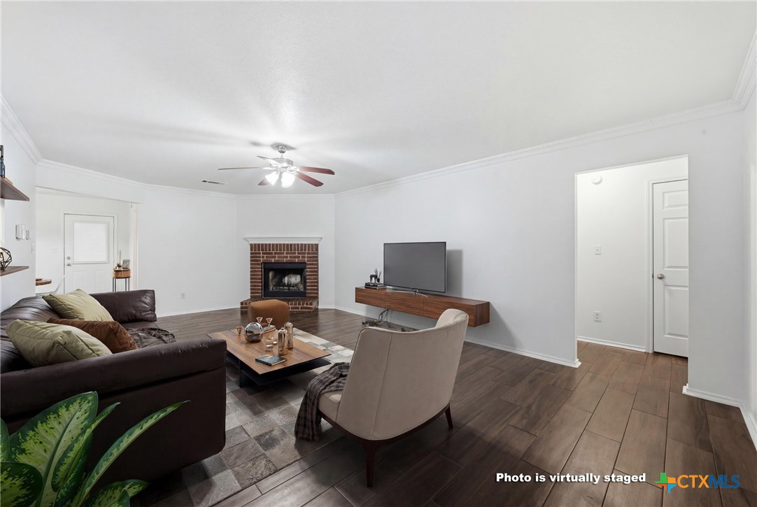 6525 Brooks Drive Temple, TX 76502 - Photo 6 of 37 a living room with furniture and a wooden floor