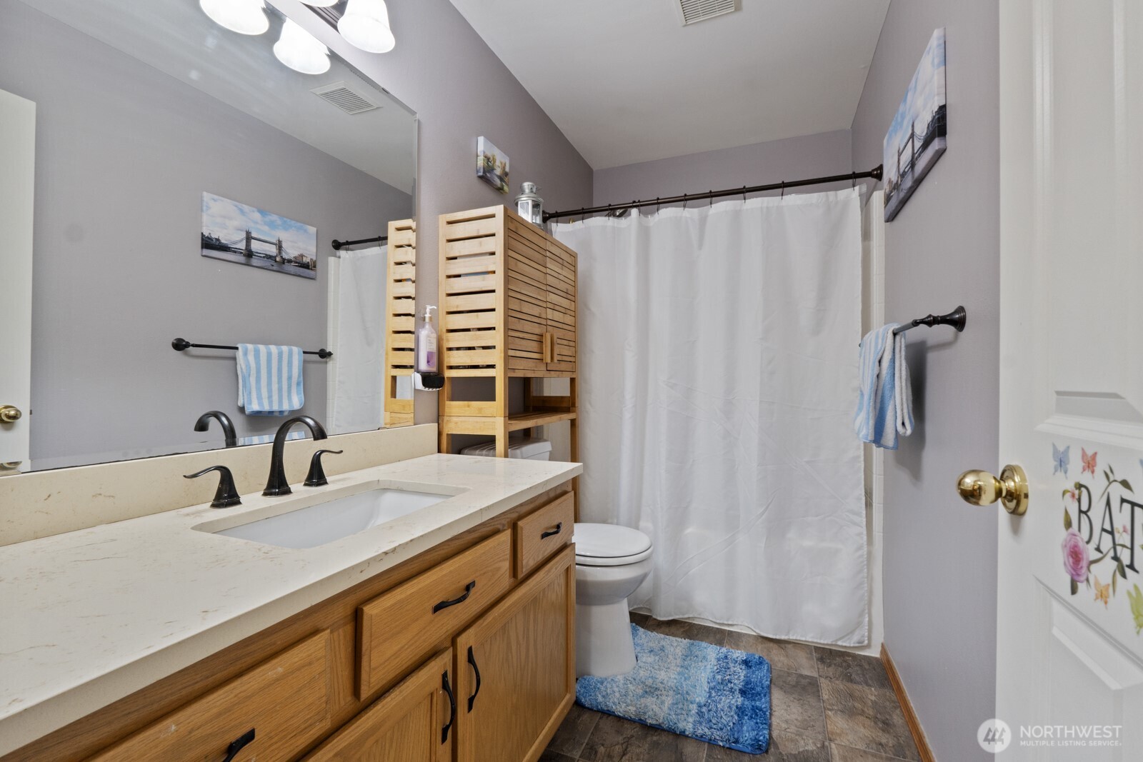 6108 133rd Place Southwest Edmonds, WA 98026 - Photo 31 of 40 a bathroom with a sink a toilet a mirror and shower