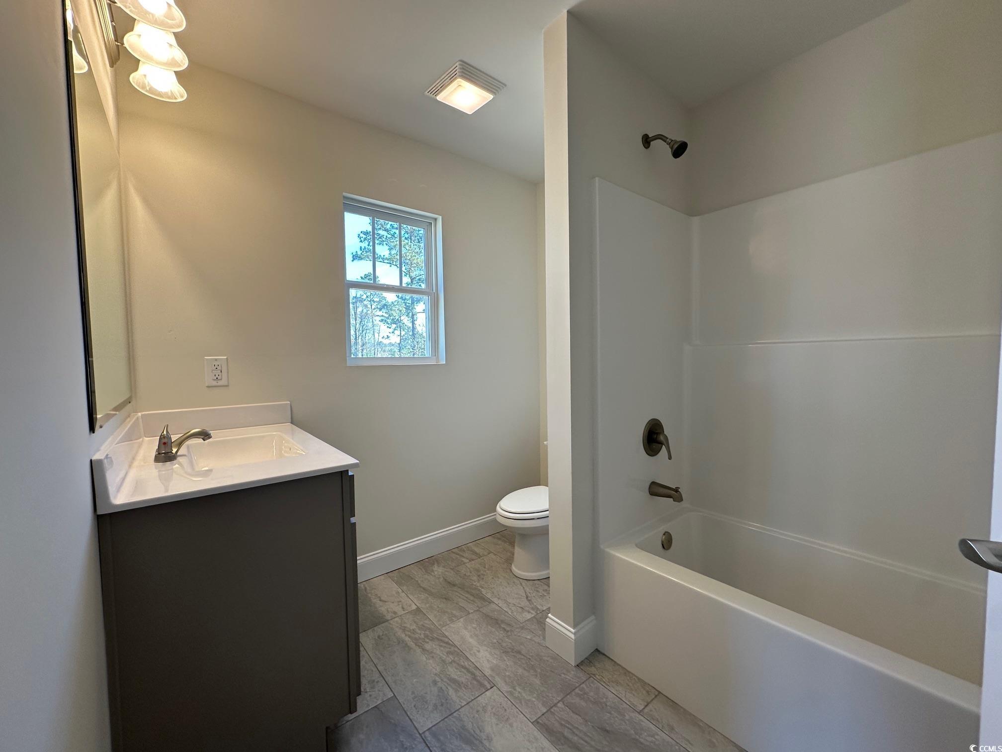 1248 Wehler Court Conway, SC 29526 - Photo 22 of 24 Bathroom featuring vanity, bathing tub / shower combination, toilet, and baseboards