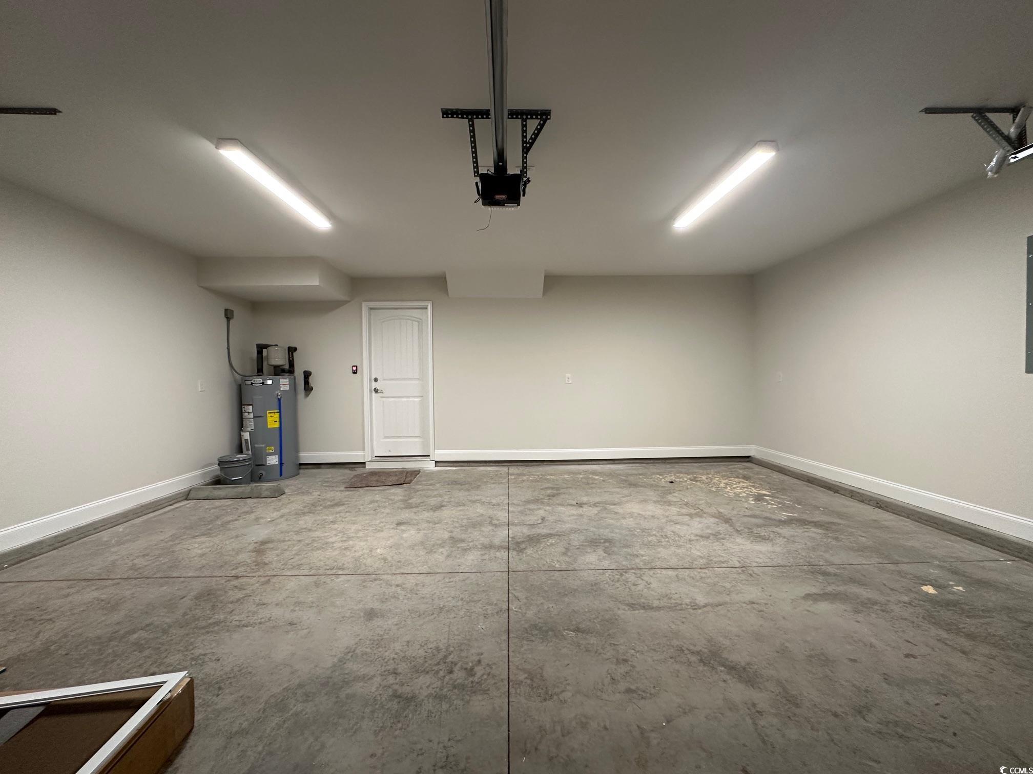 1248 Wehler Court Conway, SC 29526 - Photo 24 of 24 Garage with baseboards, a garage door opener, and water heater