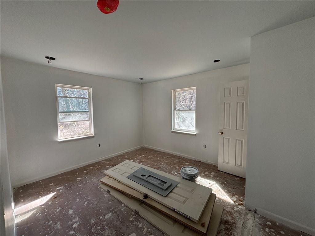 1209 Pebblebrook Road Southeast Mableton, GA 30126 - Photo 16 of 24 a view of an empty room with a window