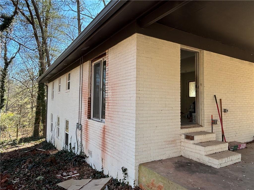1209 Pebblebrook Road Southeast Mableton, GA 30126 - Photo 3 of 24 a view of a house with a backyard