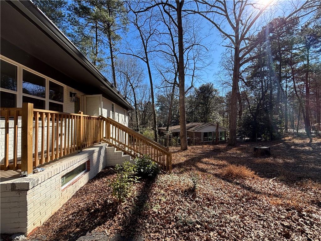 1209 Pebblebrook Road Southeast Mableton, GA 30126 - Photo 6 of 24 a view of a yard with wooden fence