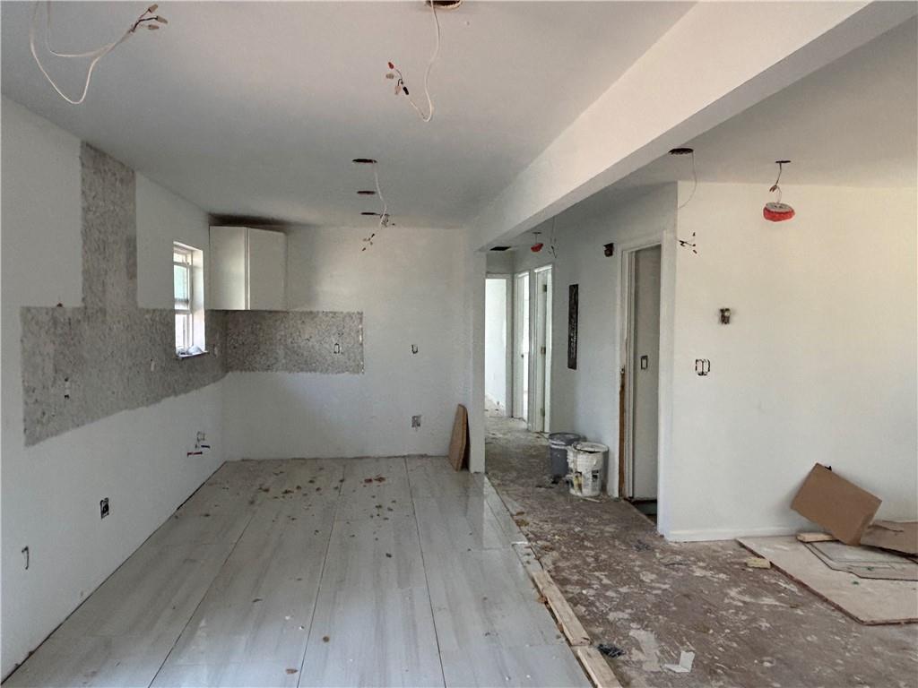 1209 Pebblebrook Road Southeast Mableton, GA 30126 - Photo 8 of 24 a view of empty room with wooden floor