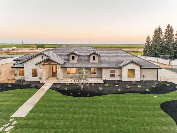 front view of a house with a yard