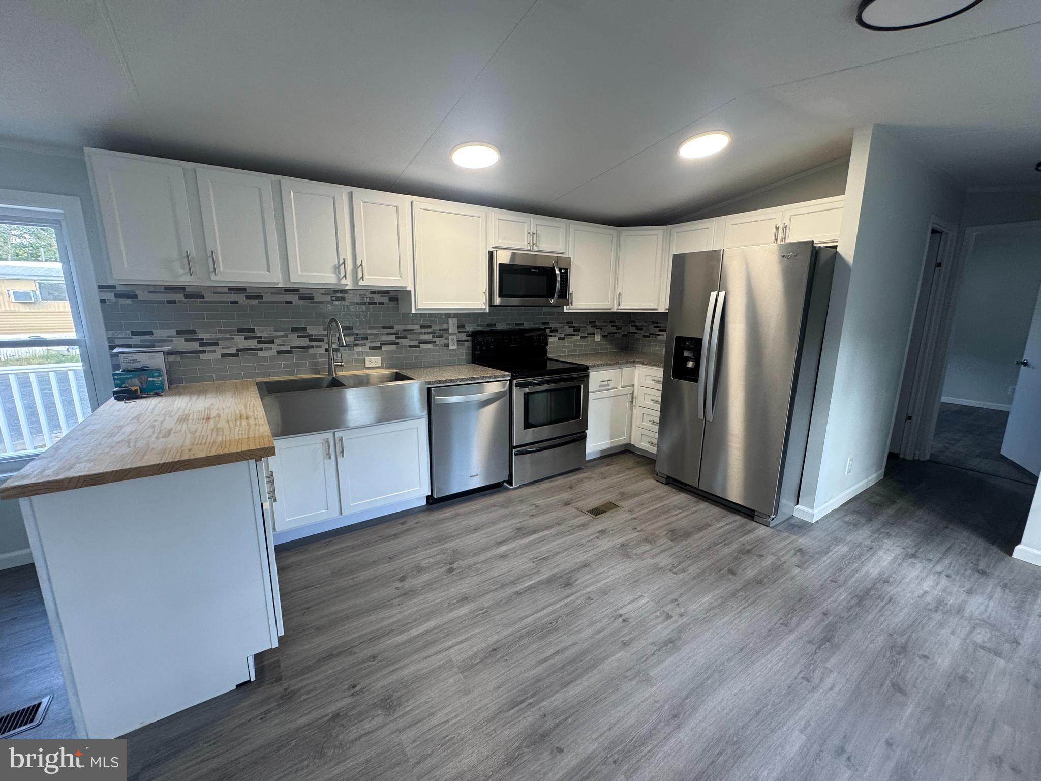37 George Drive Middletown, PA 17057 - Photo 8 of 21 a kitchen with stainless steel appliances granite countertop a refrigerator and a stove top oven