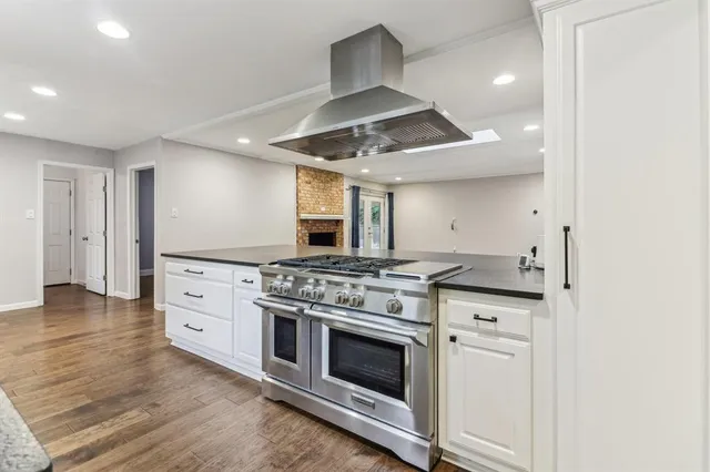 a kitchen with stainless steel appliances a stove and a refrigerator