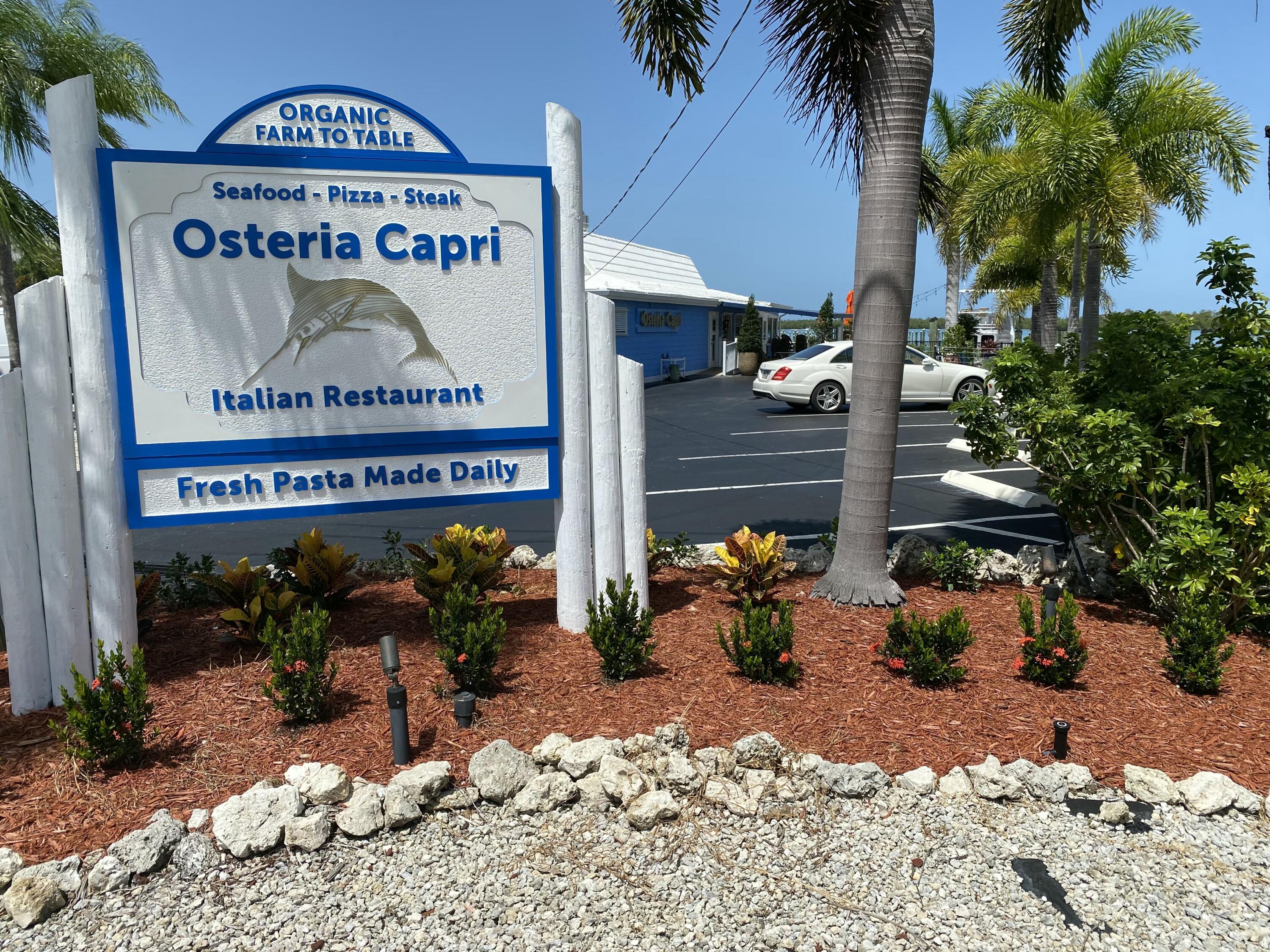 147 Capri Boulevard Naples, FL 34113 - Photo 13 of 21 a view of entryway with a table and chairs