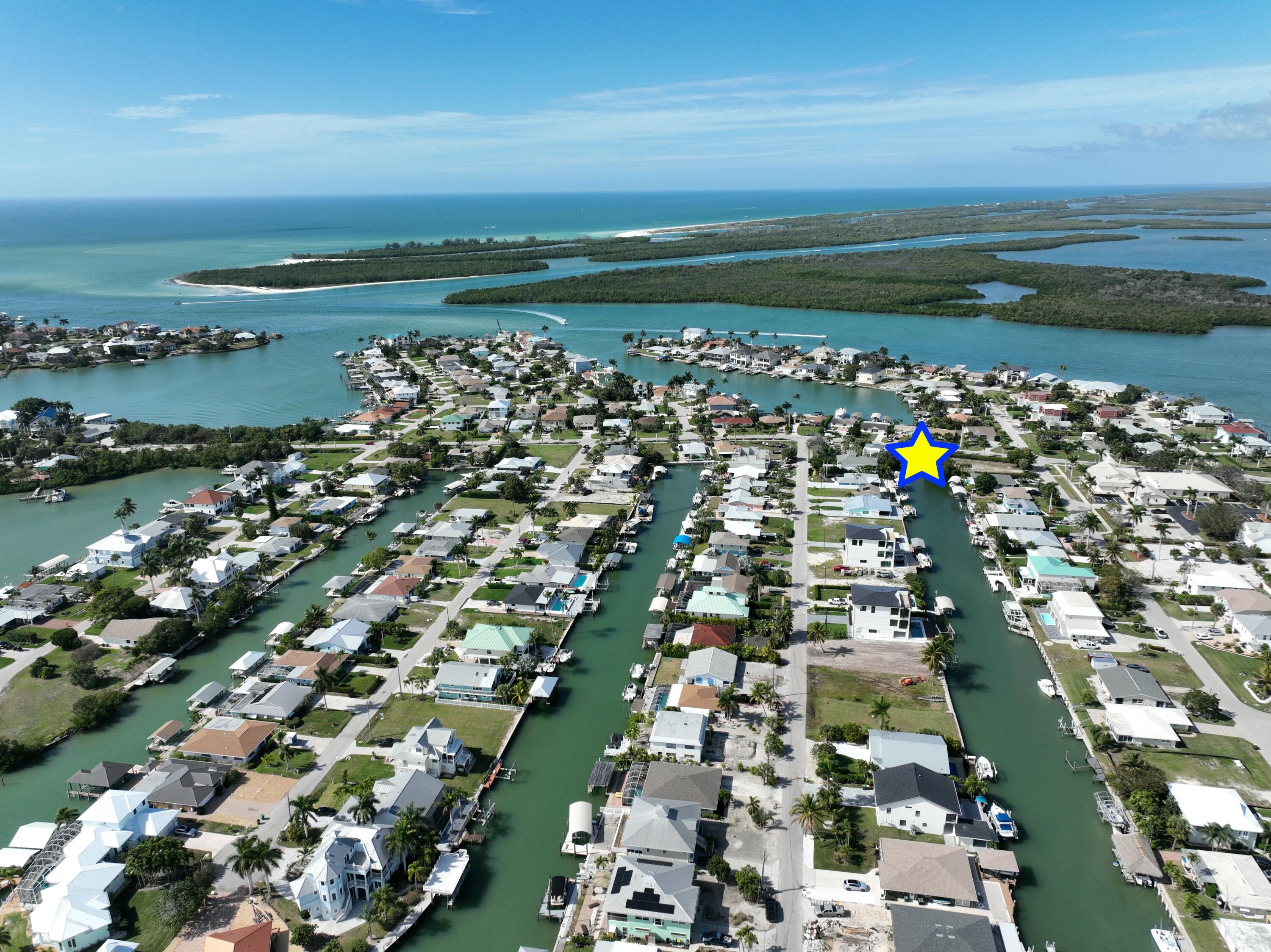 147 Capri Boulevard Naples, FL 34113 - Photo 3 of 21 view of city and ocean