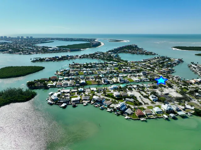 an aerial view of a house with a garden