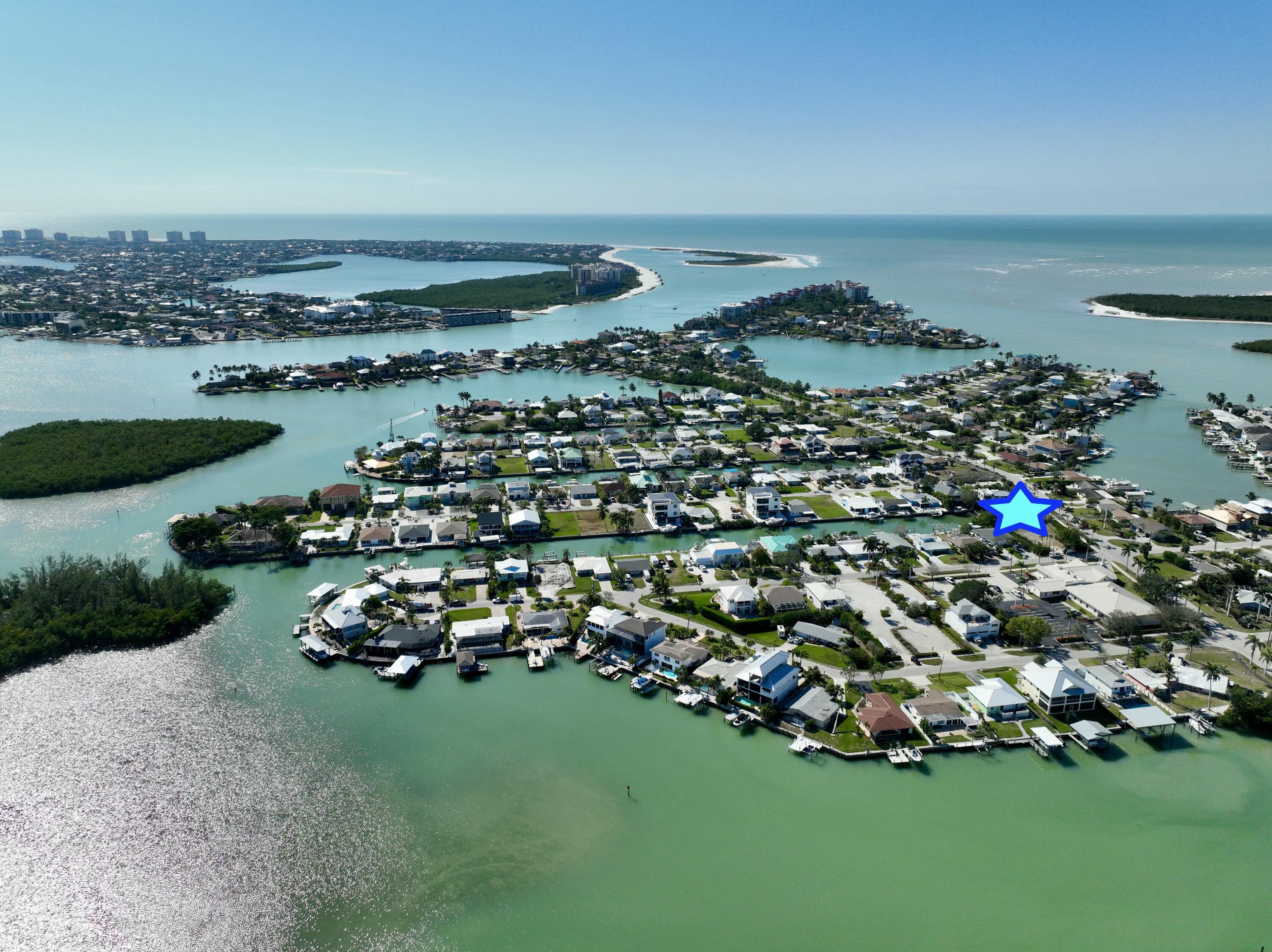 147 Capri Boulevard Naples, FL 34113 - Photo 7 of 21 an aerial view of a house with a garden