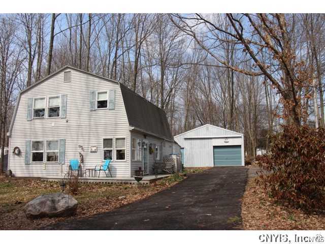 164 Wanner Road Vienna, NY 13042 - Photo 1 of 1 Exterior Front. Spring Flowers just peeking throug