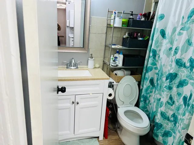 a bathroom with a toilet and a sink