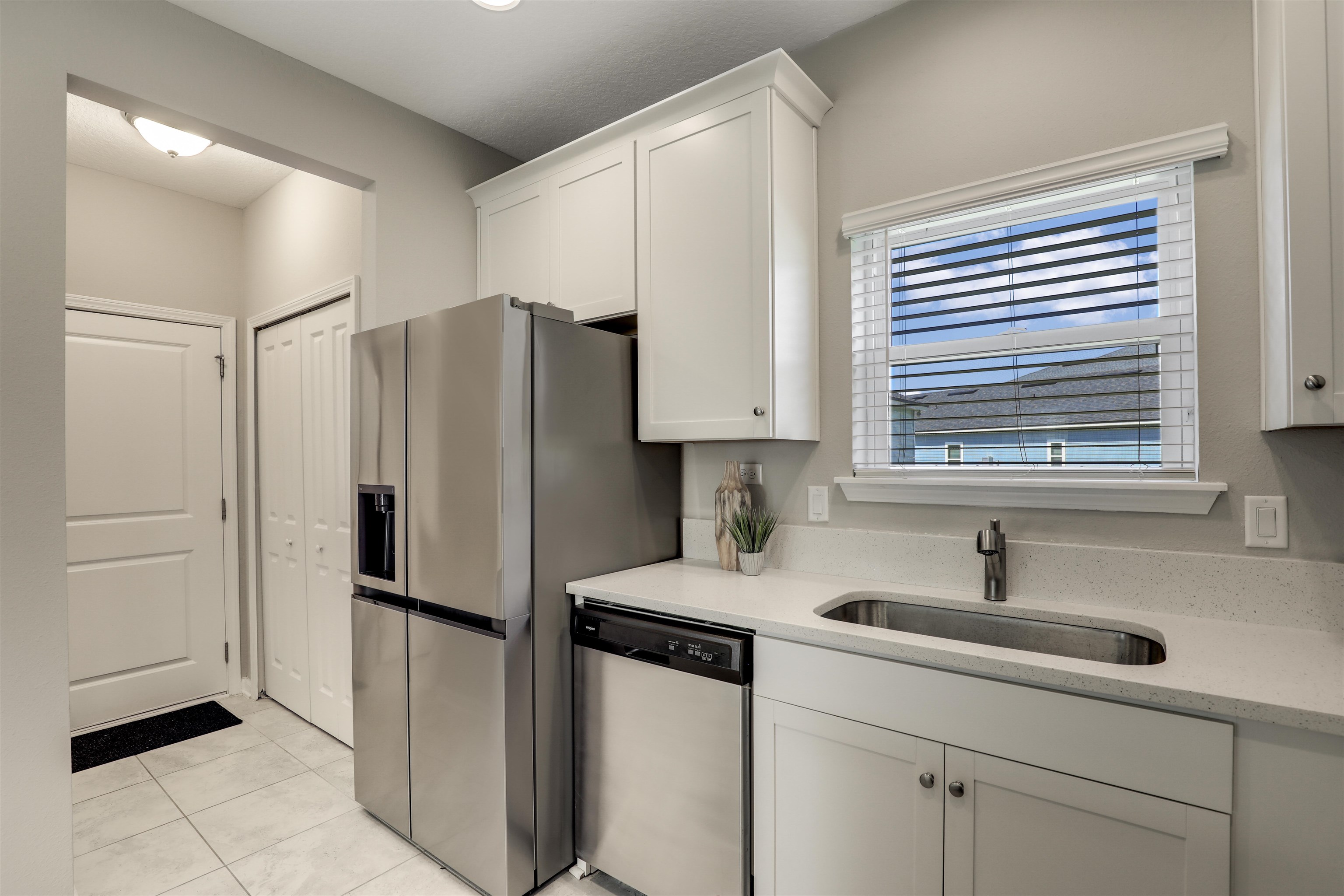 333 Bermudez Way St. Augustine, FL 32095 - Photo 17 of 62 a kitchen with stainless steel appliances a refrigerator sink and cabinets