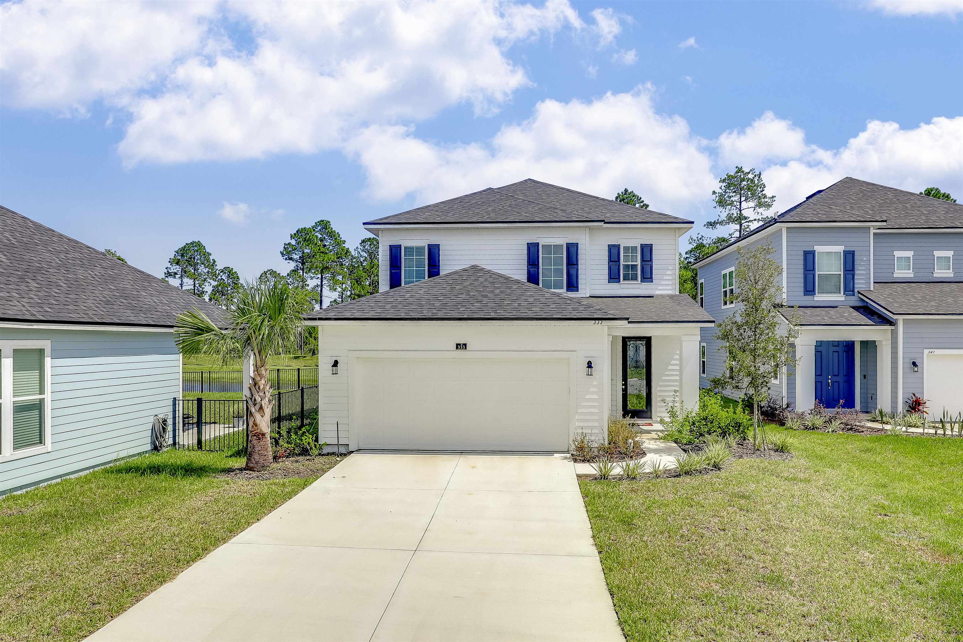 333 Bermudez Way St. Augustine, FL 32095 - Photo 2 of 62 a front view of a house with garden