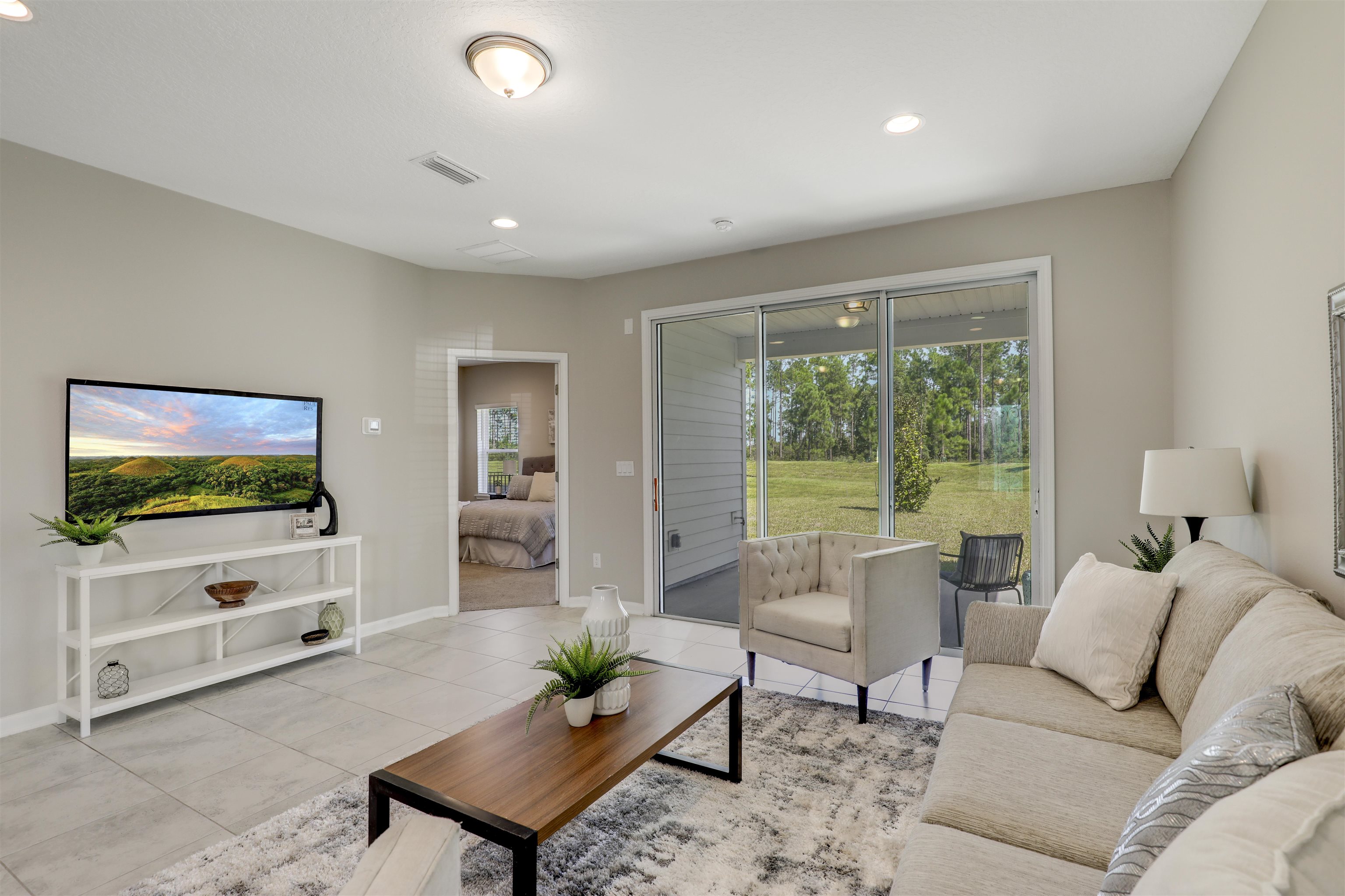 333 Bermudez Way St. Augustine, FL 32095 - Photo 21 of 62 a living room with furniture and a flat screen tv