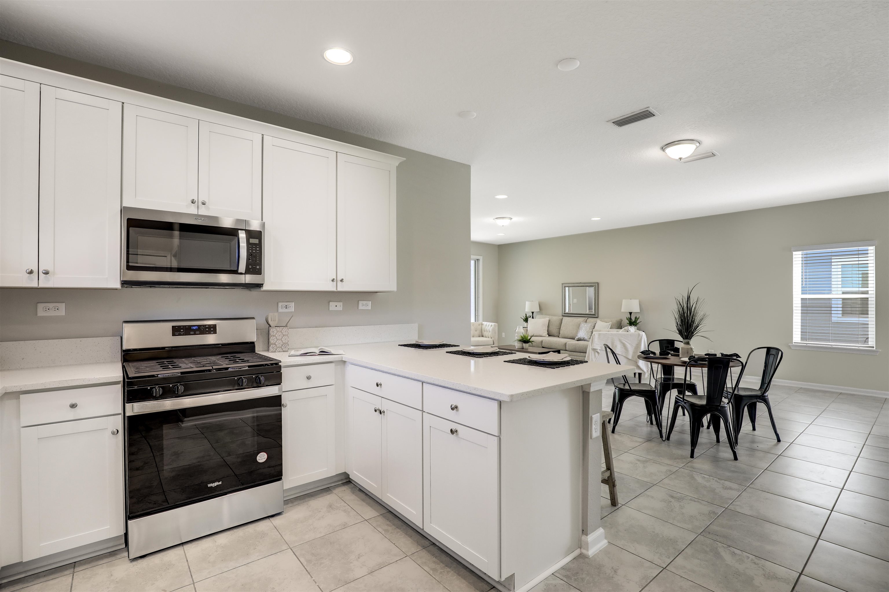 333 Bermudez Way St. Augustine, FL 32095 - Photo 3 of 62 a kitchen with a sink and chairs