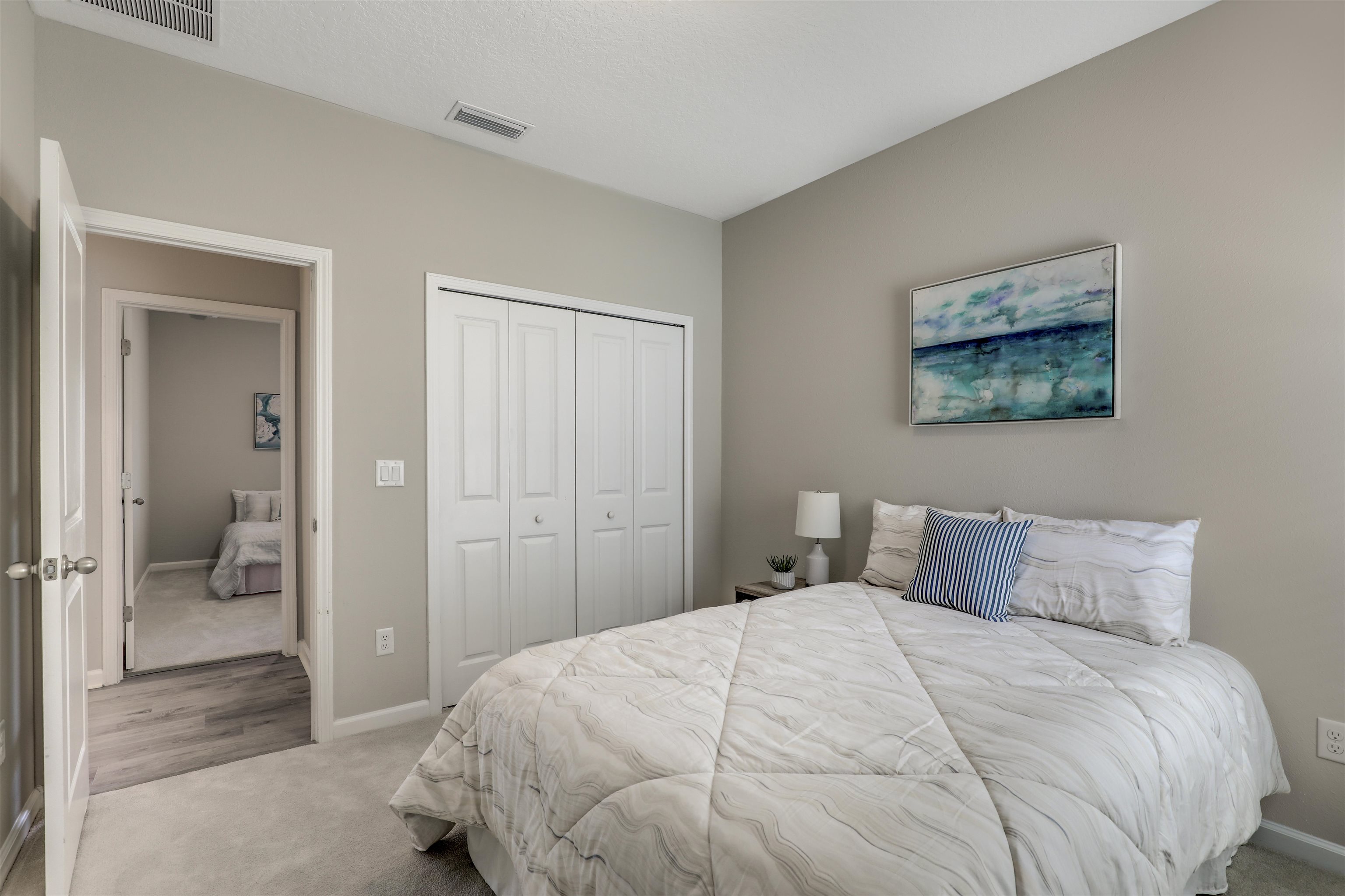 333 Bermudez Way St. Augustine, FL 32095 - Photo 32 of 62 a bedroom with a bed and a painting on the wall