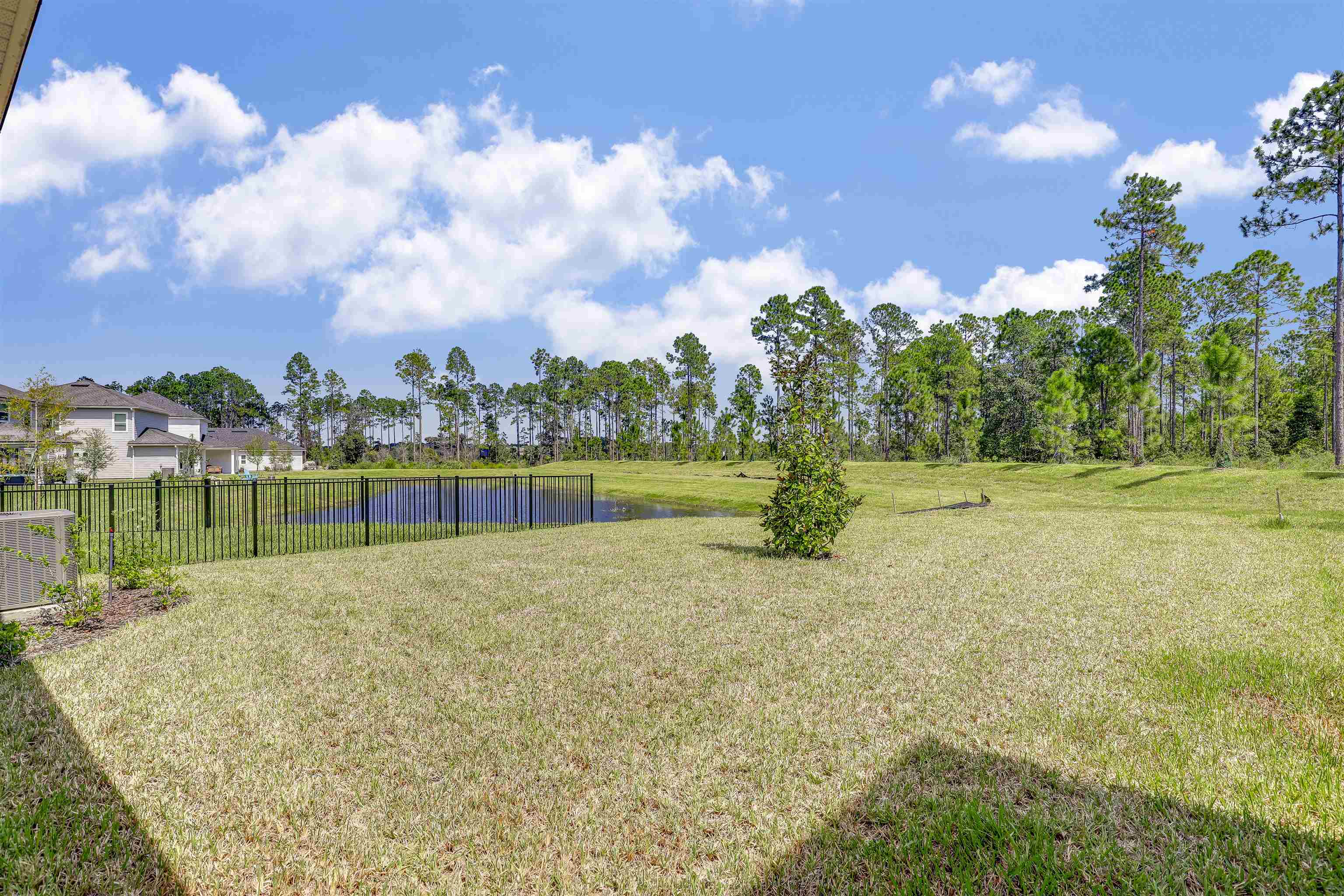 333 Bermudez Way St. Augustine, FL 32095 - Photo 44 of 62 a view of a golf course with a lake