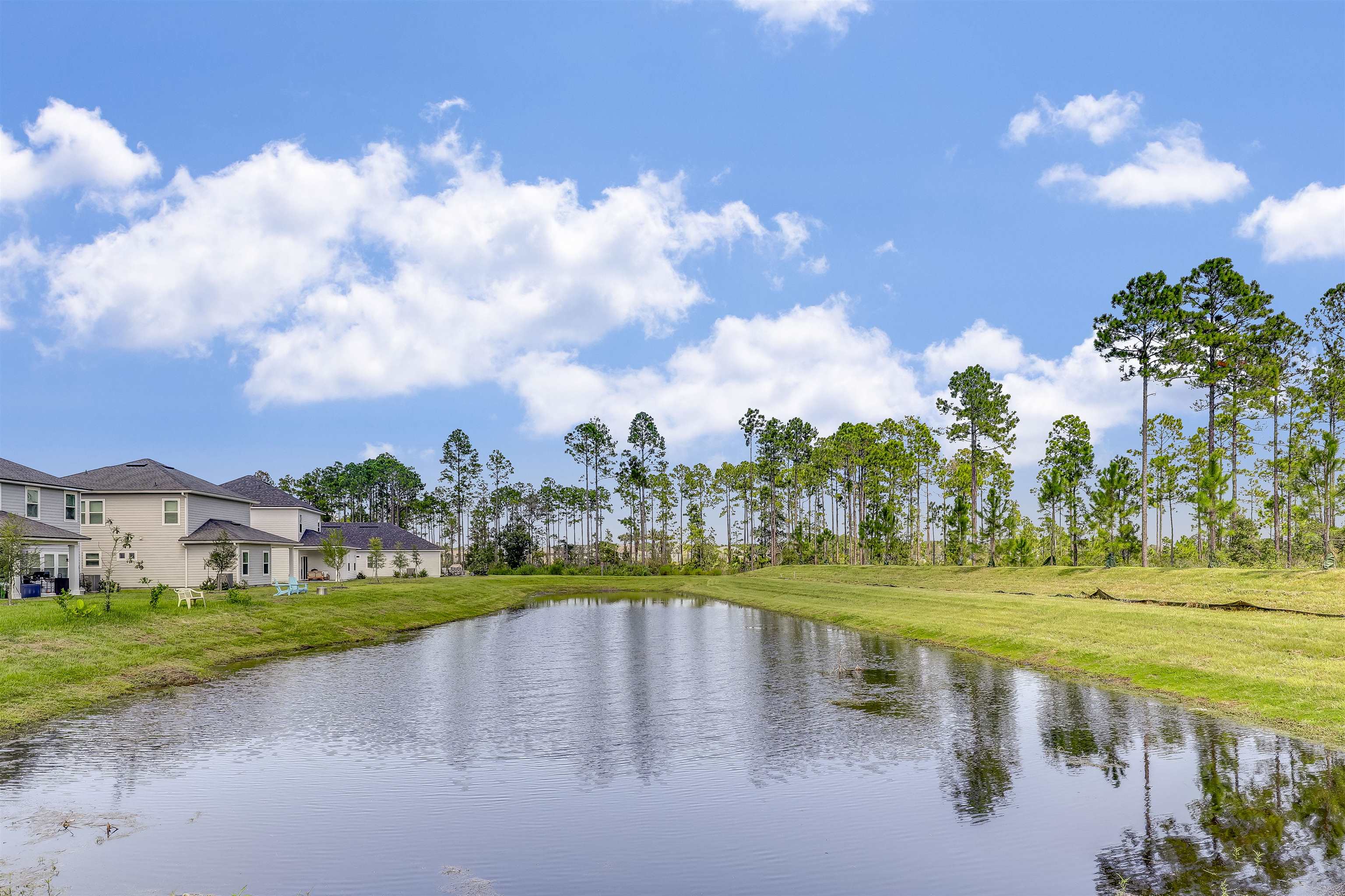 333 Bermudez Way St. Augustine, FL 32095 - Photo 45 of 62 a view of a lake with houses in the back