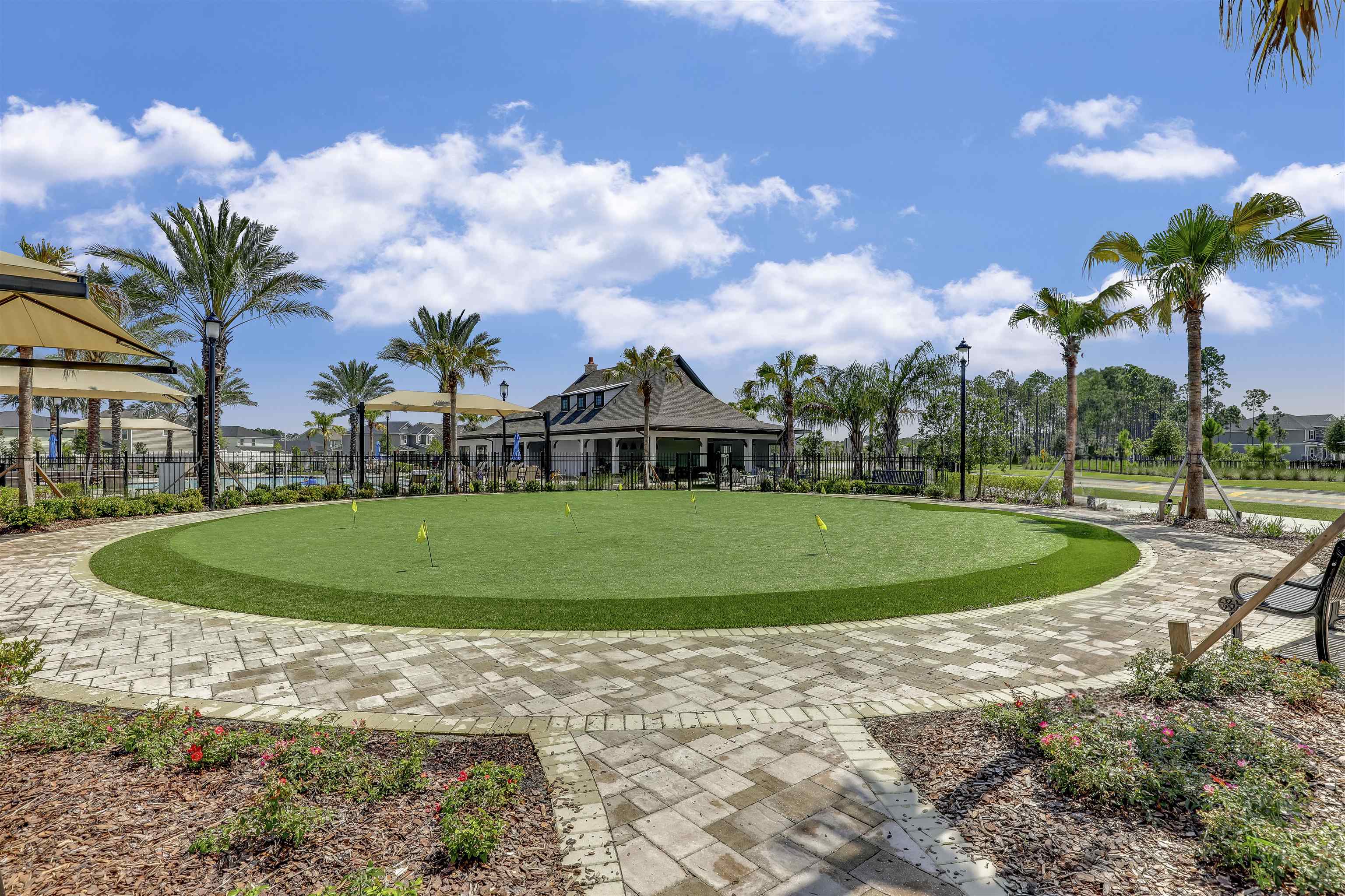 333 Bermudez Way St. Augustine, FL 32095 - Photo 55 of 62 a view of a white house with a big yard and palm trees