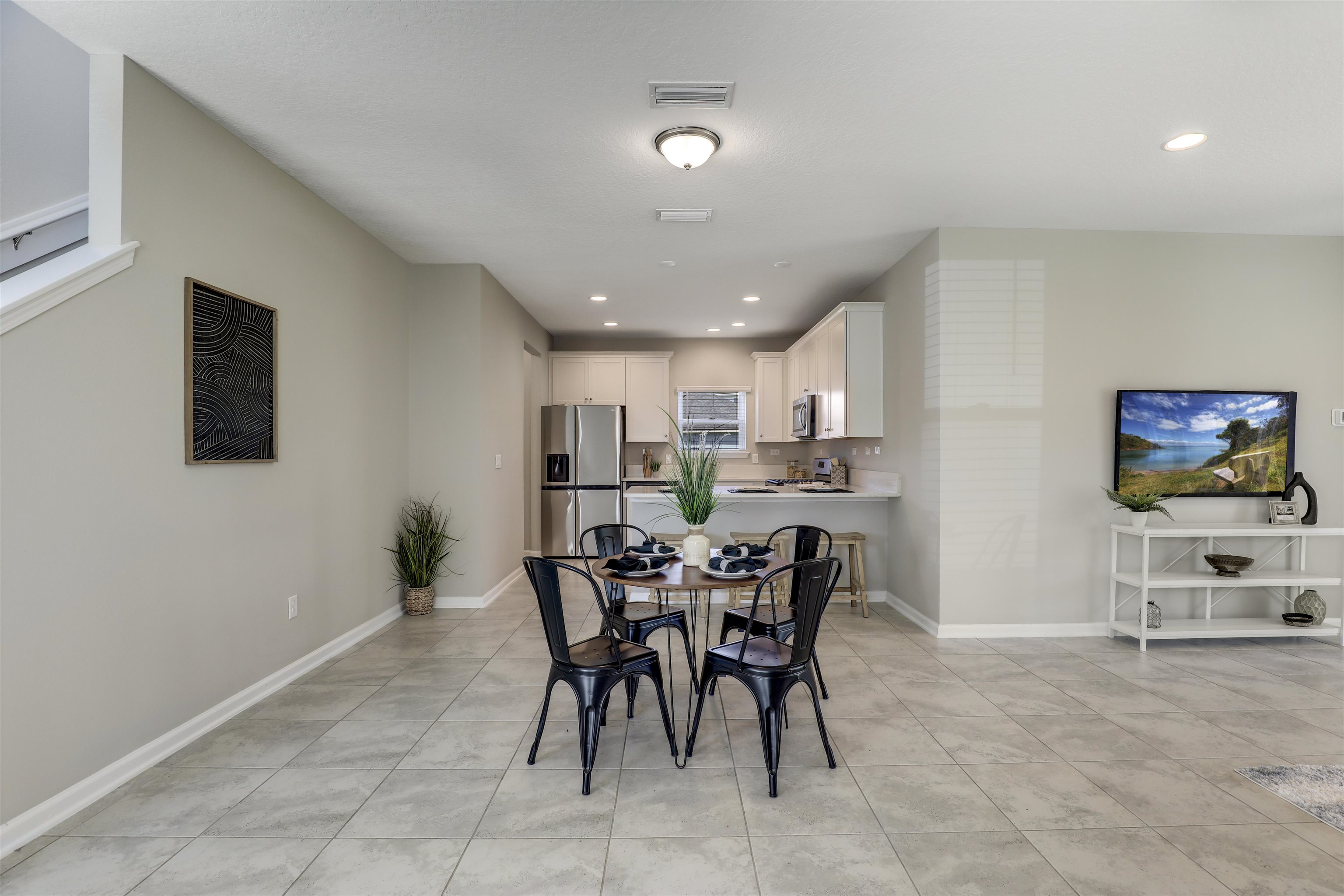 333 Bermudez Way St. Augustine, FL 32095 - Photo 10 of 62 a view of a dining room with furniture and a chandelier