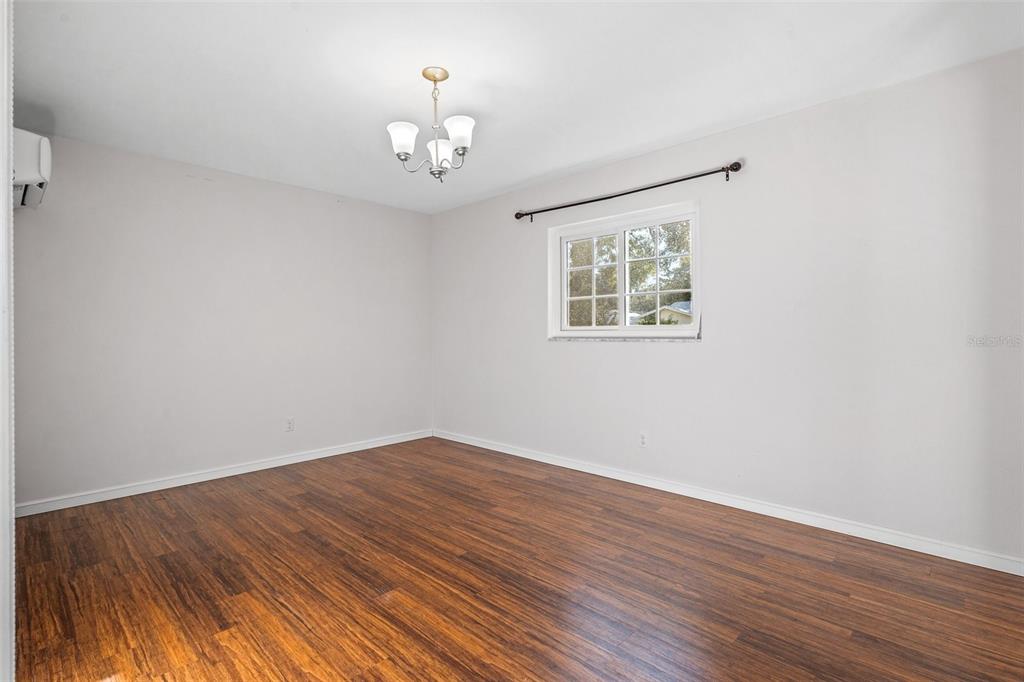 2033 Little Neck Road Clearwater, FL 33755 - Photo 24 of 39 Large master bedroom with beautiful wood floors and separate temperature control