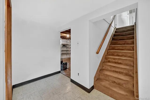 a view of an entryway with stairs