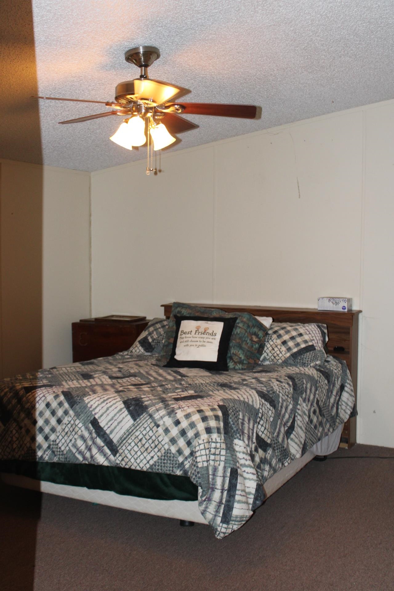 7067 Edith-Nankipoo Road Ripley, TN 38063 - Photo 22 of 38 a bedroom with a bed and a chandelier