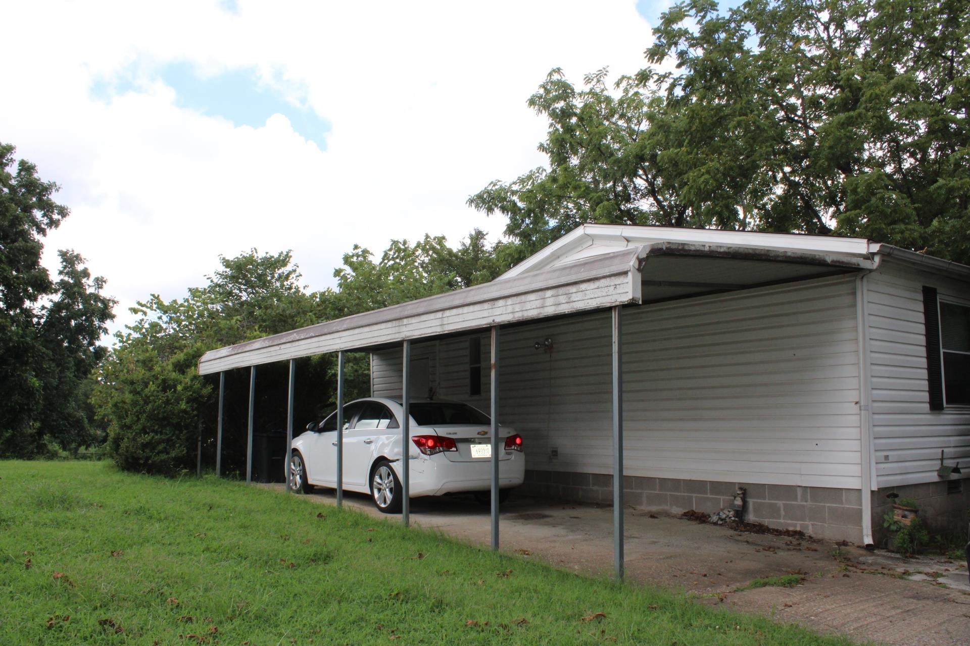7067 Edith-Nankipoo Road Ripley, TN 38063 - Photo 29 of 38 a front view of a house with garden