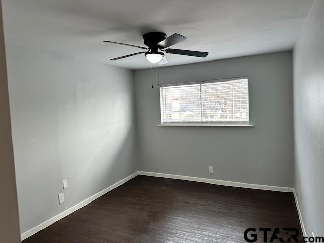 3206 Bain Place Tyler, TX 75701 - Photo 11 of 18 an empty room with wooden floor fan and windows