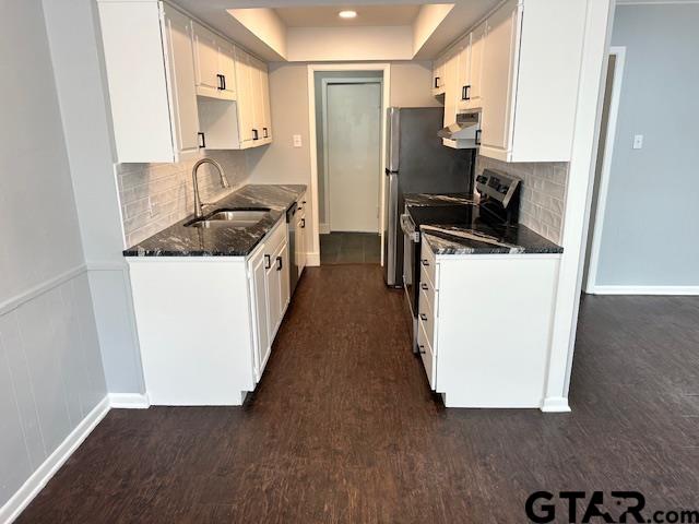 3206 Bain Place Tyler, TX 75701 - Photo 12 of 18 a kitchen with sink cabinets and a stove