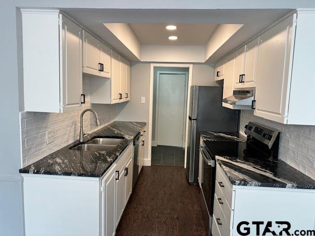 3206 Bain Place Tyler, TX 75701 - Photo 3 of 18 a kitchen with a sink stove top oven and refrigerator