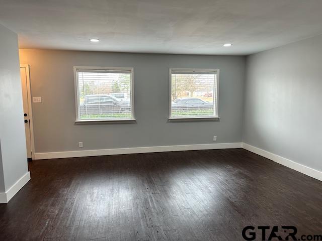 3206 Bain Place Tyler, TX 75701 - Photo 4 of 18 an empty room with wooden floor and windows