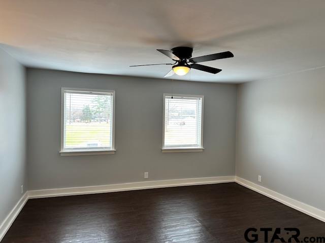 3206 Bain Place Tyler, TX 75701 - Photo 9 of 18 a view of an empty room with wooden floor and a window