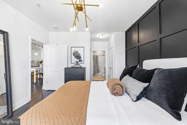 a bedroom with a bed and walk in closet