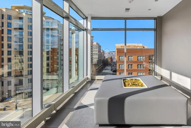 a view of a living room and a balcony