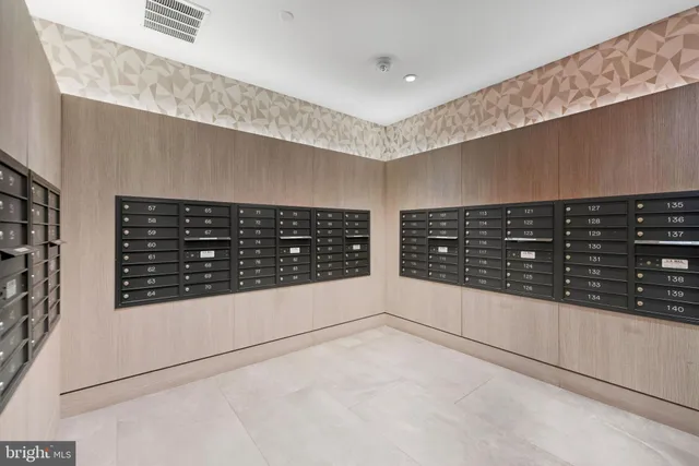 a view of kitchen with stainless steel appliances a refrigerator and a stove top oven