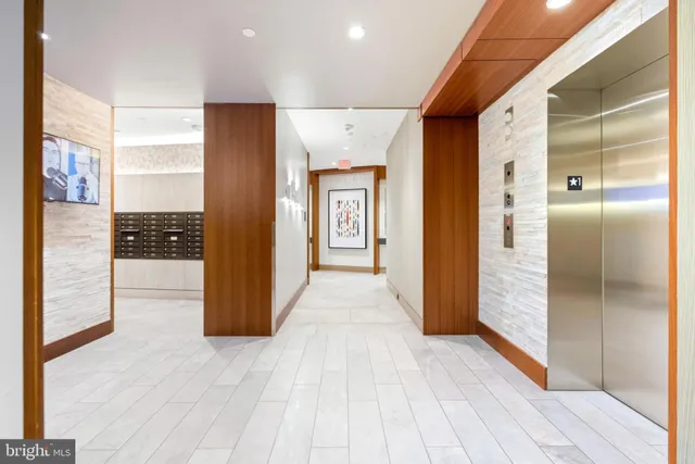a view of hallway with wooden floor