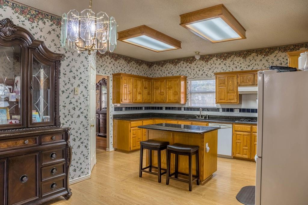 4113 Bluffpoint Road Rowlett, TX 75088 - Photo 13 of 39 a kitchen with a sink and cabinets
