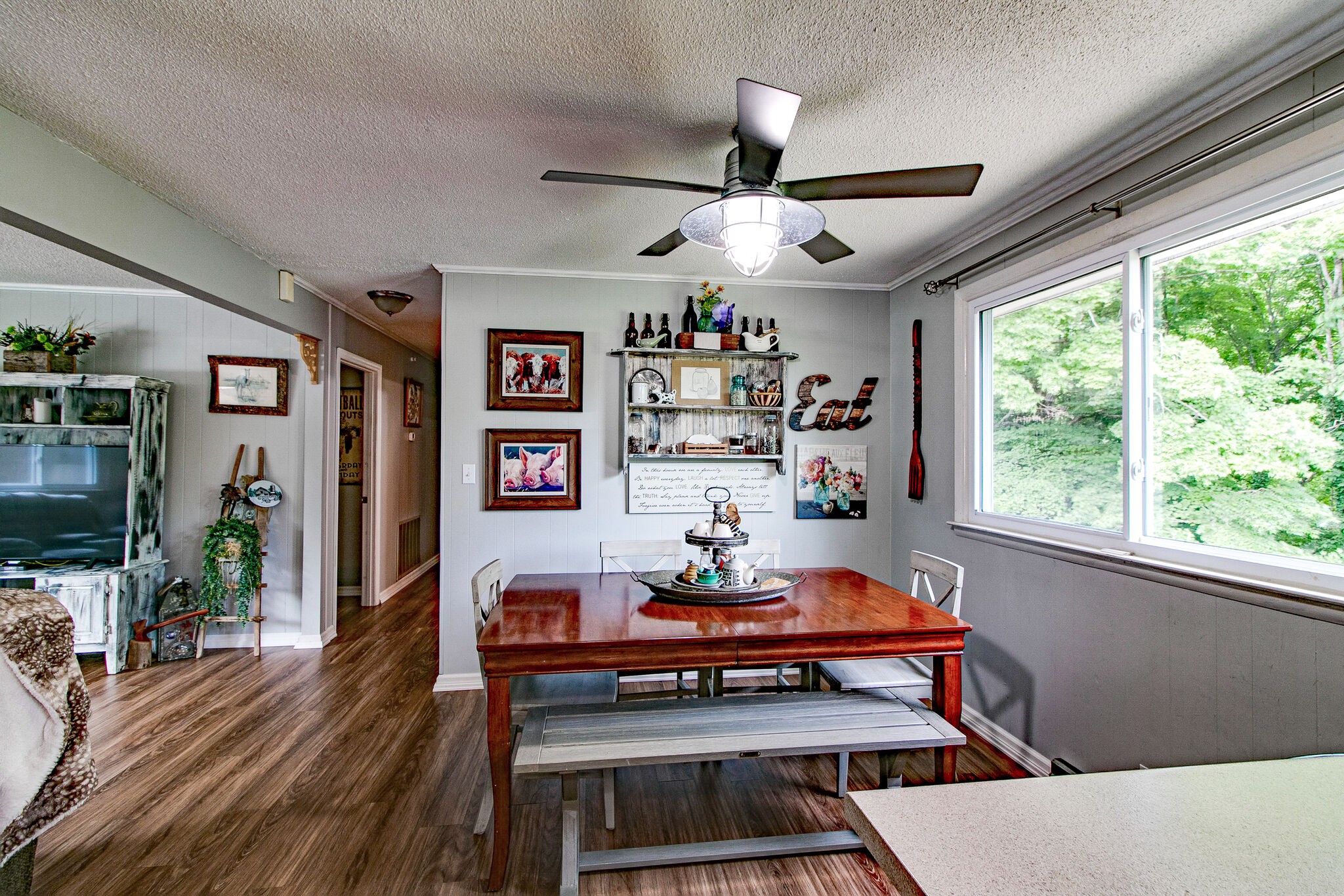 351 Dean Road Clarksville, TN 37040 - Photo 24 of 39 a living room with furniture a flat screen tv and a floor to ceiling window