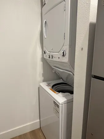 a close view of utility room with washer and dryer