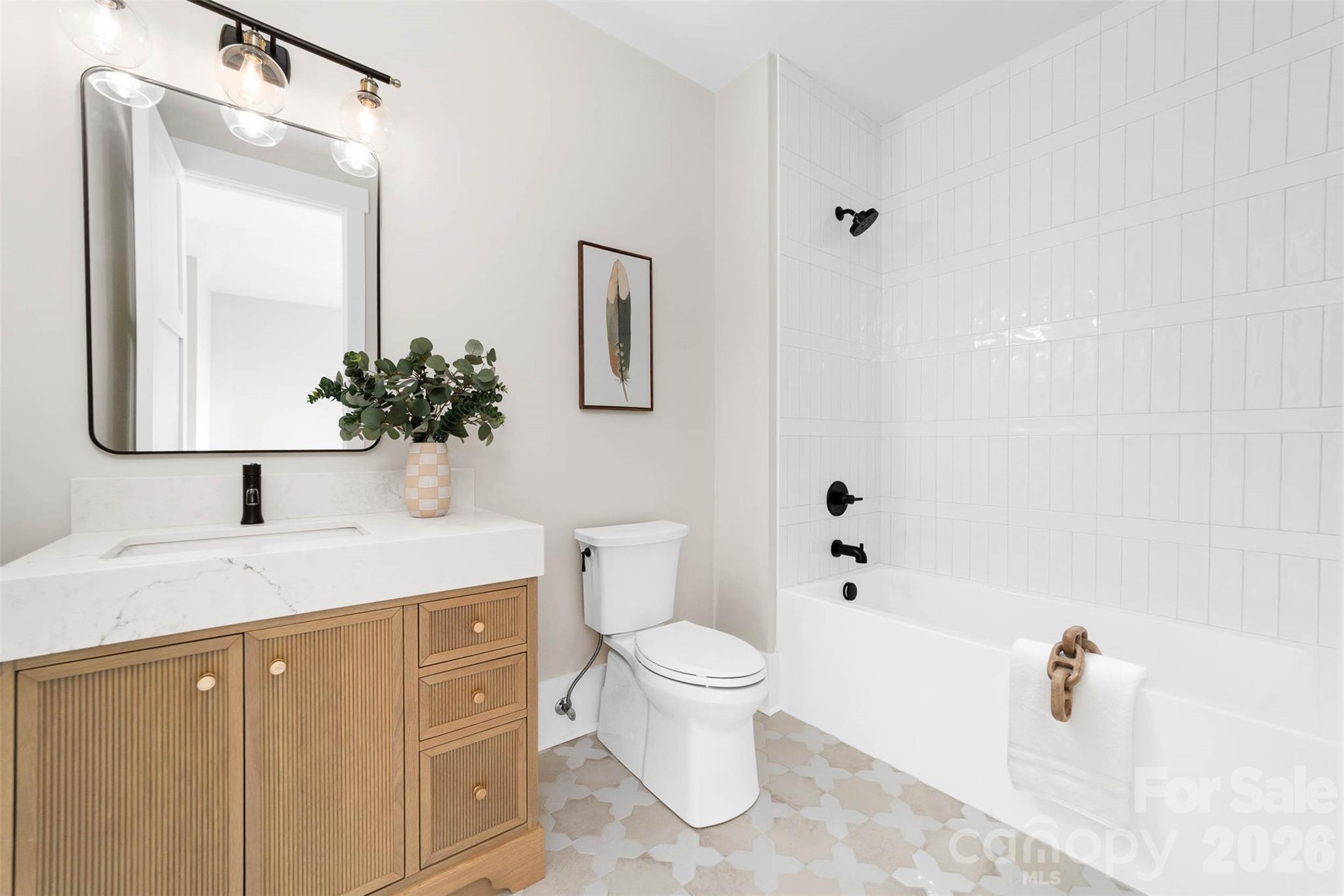 216 Walnut Street Davidson, NC 28036 - Photo 32 of 48 a bathroom with a granite countertop sink mirror and toilet