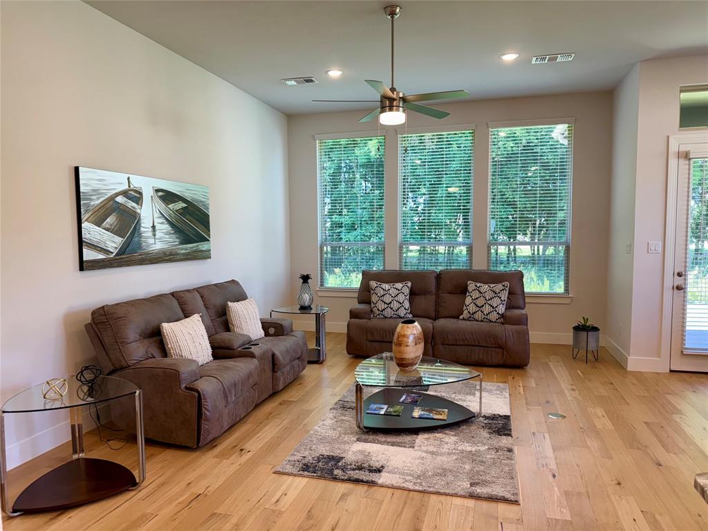 1835 Bell Court Van Alstyne, TX 75495 - Photo 2 of 20 a living room with furniture and a large window