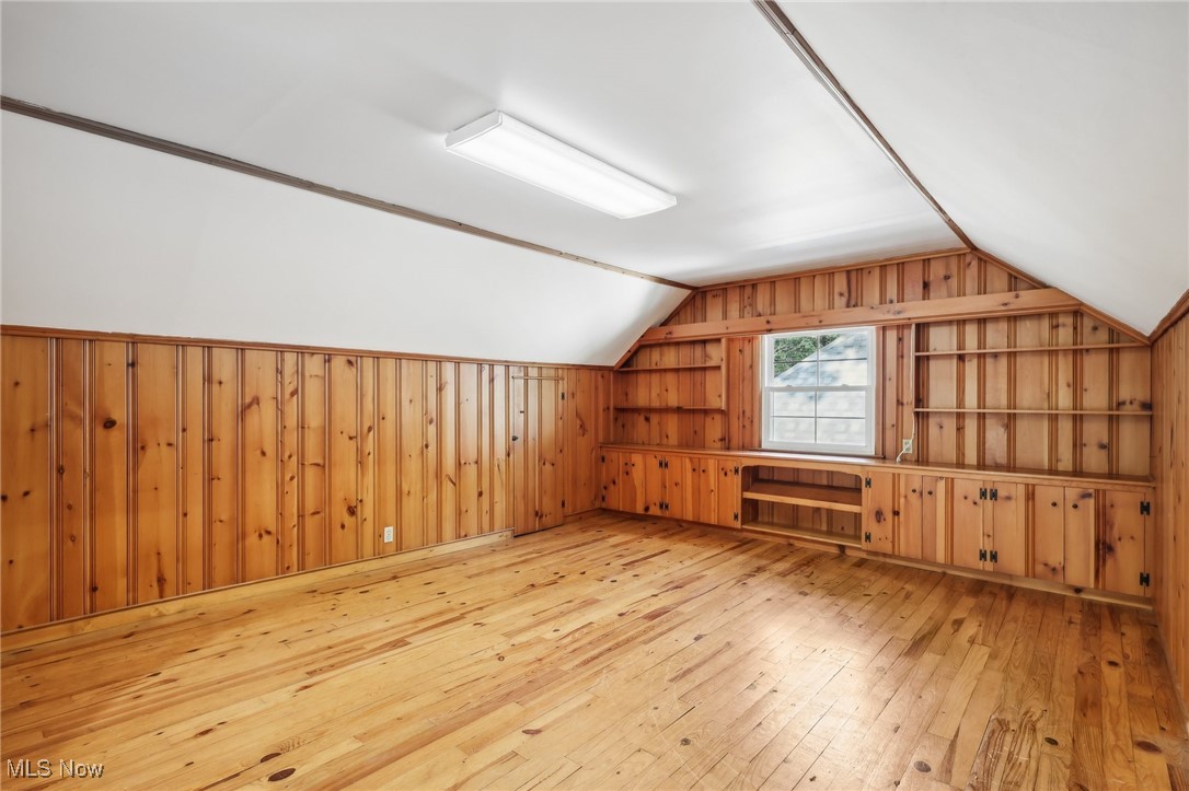 1042 Renfield Road Cleveland Heights, OH 44121 - Photo 27 of 49 Additional living space featuring light hardwood / wood-style floors, wooden walls, and lofted ceiling