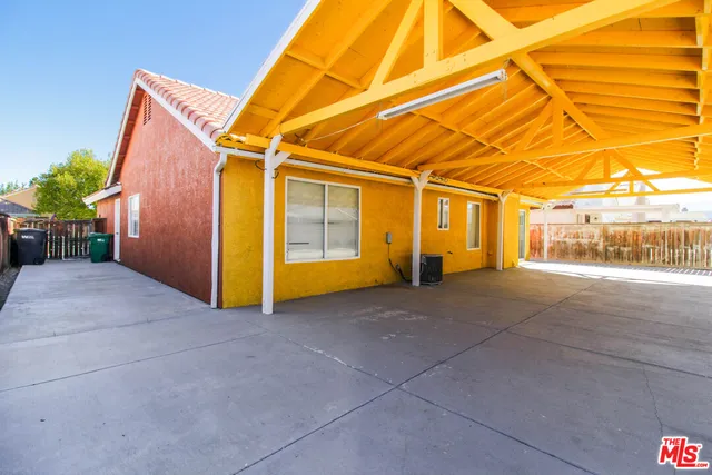 a view of backyard with garage