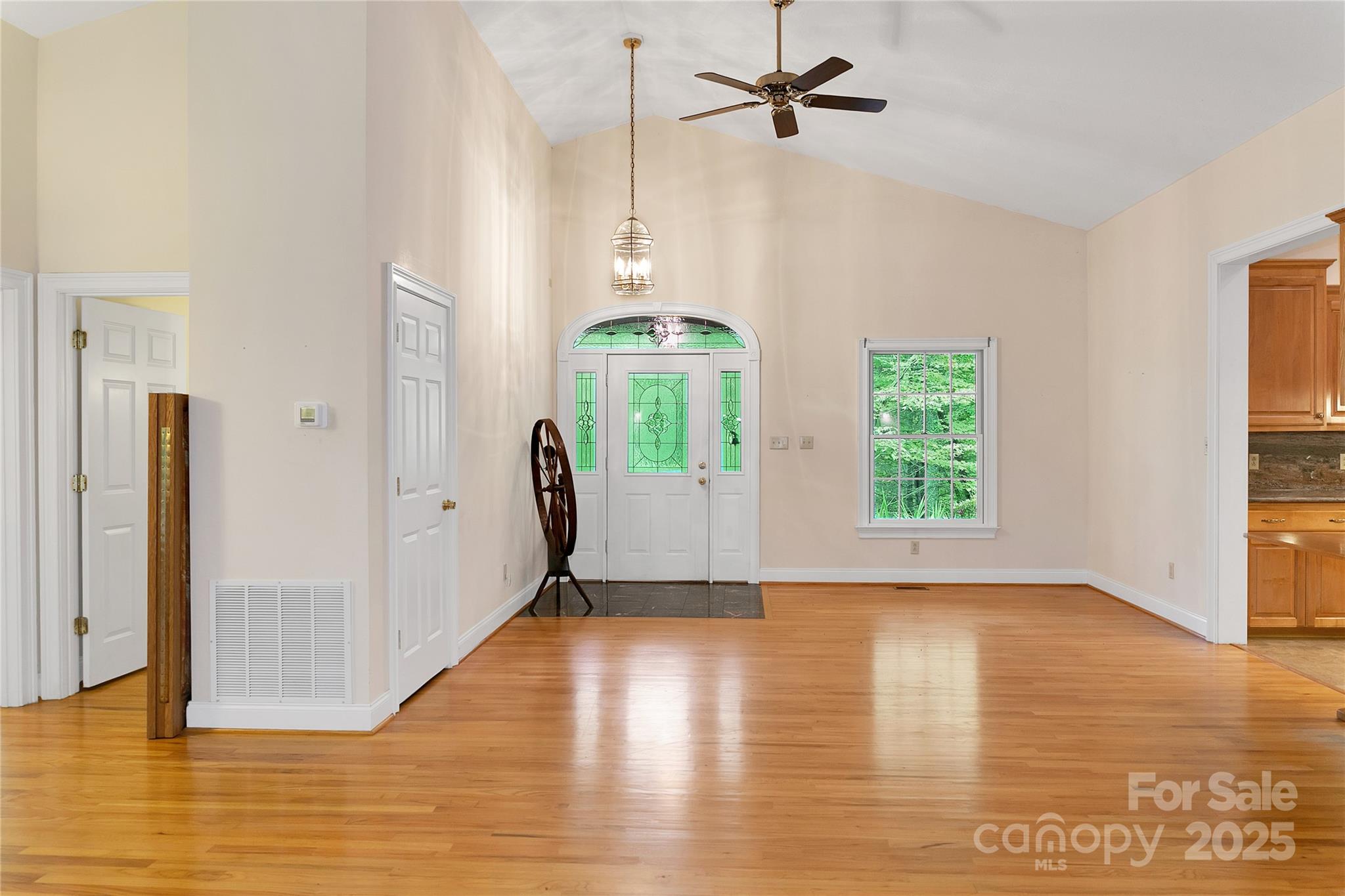 273 Inoli Circle Brevard, NC 28712 - Photo 12 of 47 a view of an empty room with window and wooden floor
