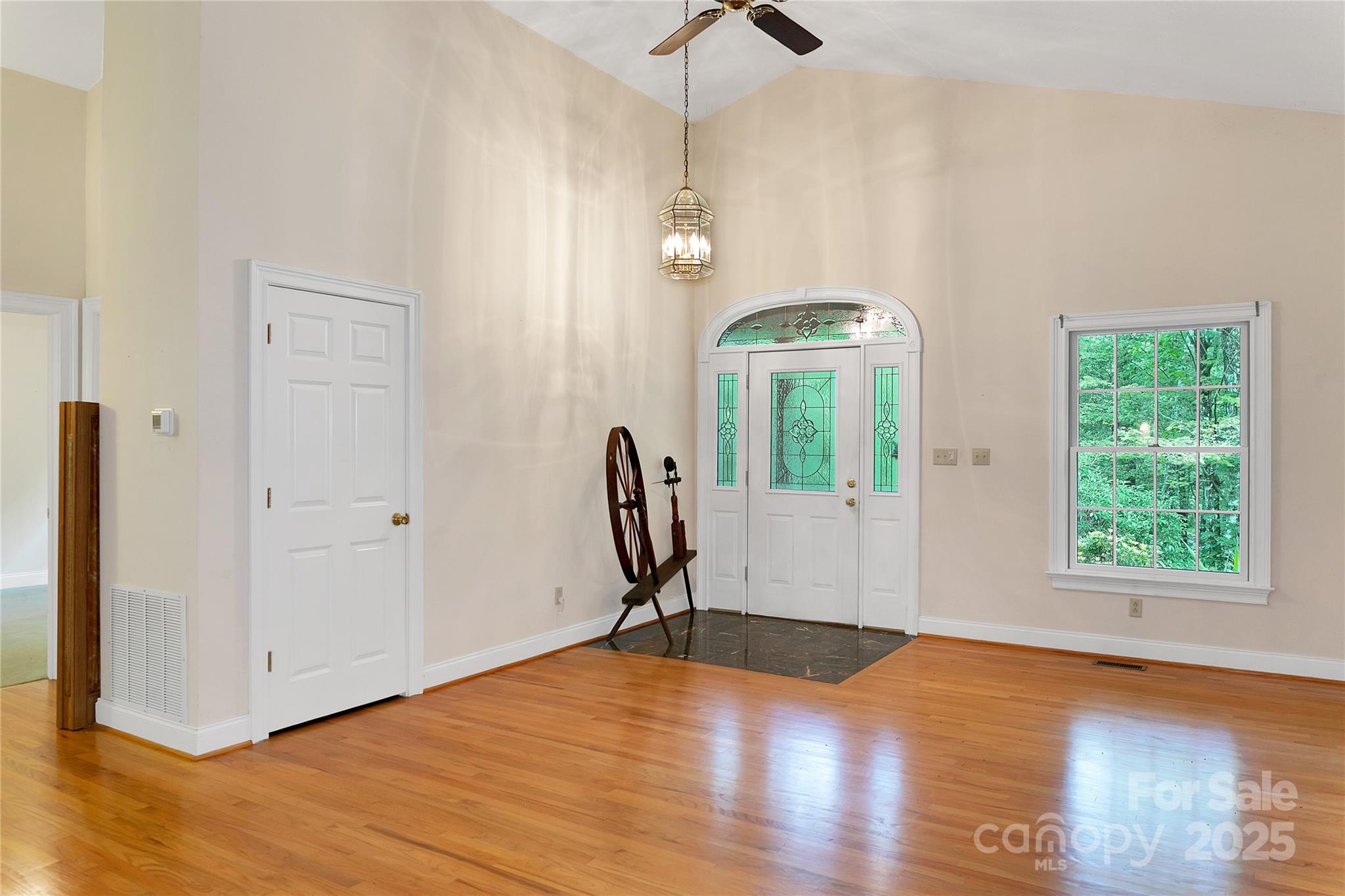 273 Inoli Circle Brevard, NC 28712 - Photo 13 of 47 a view of a room with wooden floor lounge chair and windows