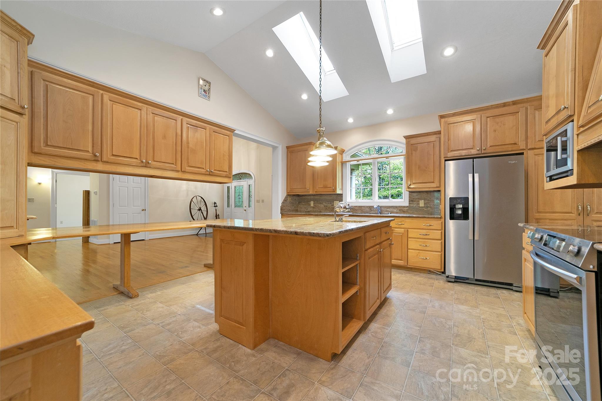 273 Inoli Circle Brevard, NC 28712 - Photo 19 of 47 a kitchen with stainless steel appliances granite countertop a refrigerator a sink and a stove